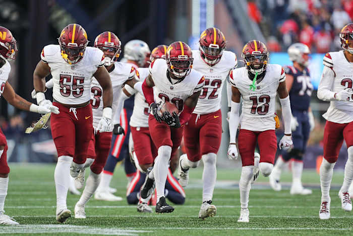 Nov 5, 2023; Foxborough, Massachusetts, USA; Washington Commanders cornerback Jartavius Martin (20) celebrates after an interception during the second half against the New England Patriots at Gillette Stadium.
